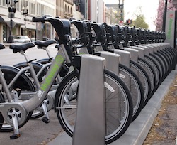 Photo of a line of city bikes at a bike station